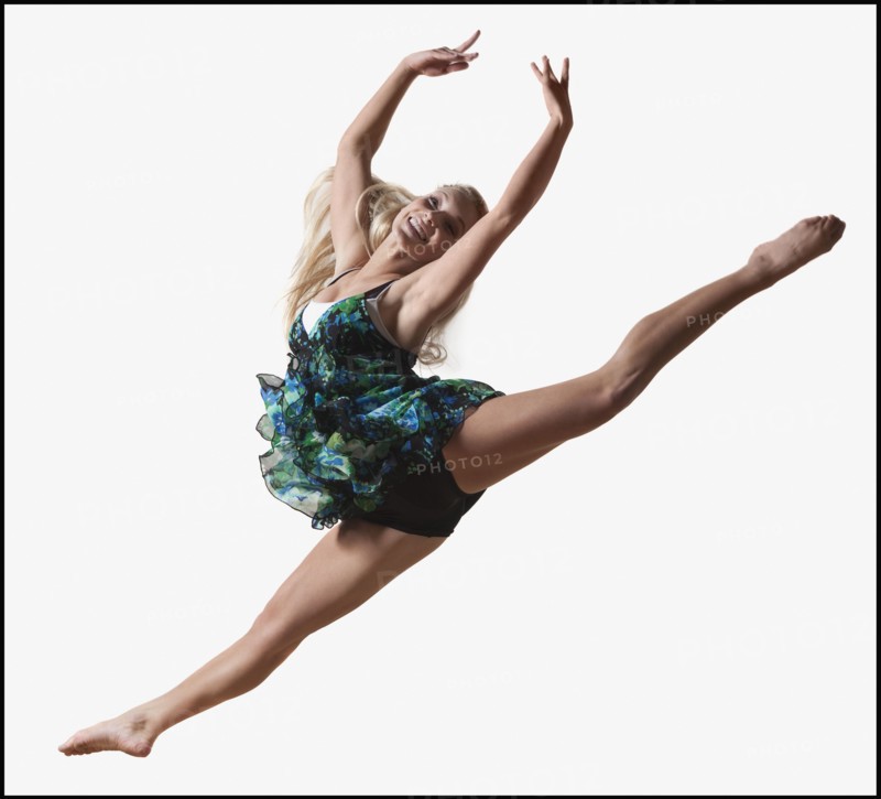 Female dancer jumping gracefully in the air. Photo : Mike Kemp