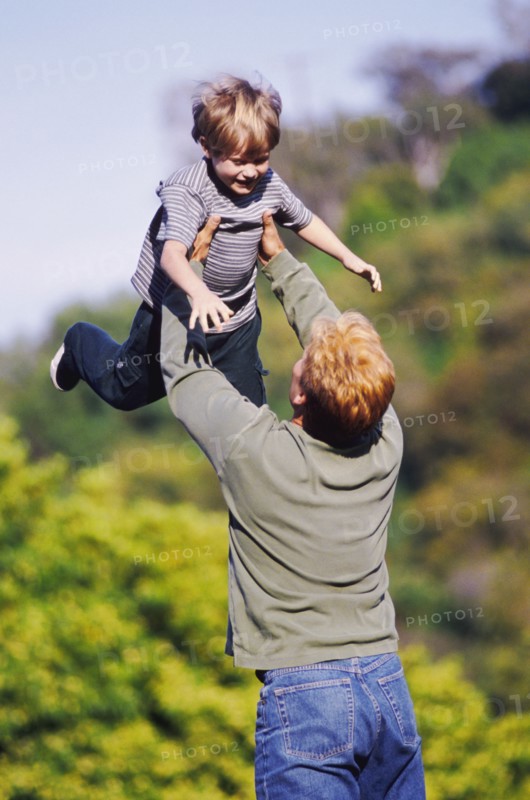 Father playing outside with his young son. Photo : Rob Lewine