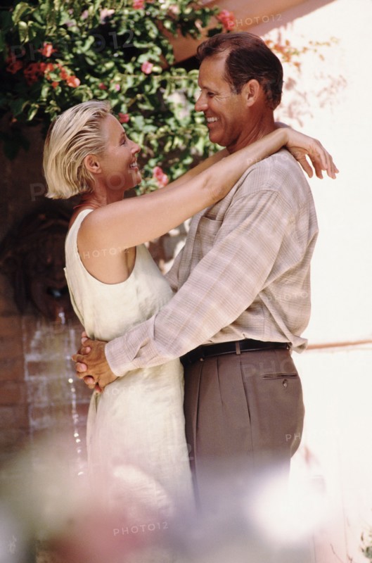 Middle aged couple embracing. Photo : Rob Lewine