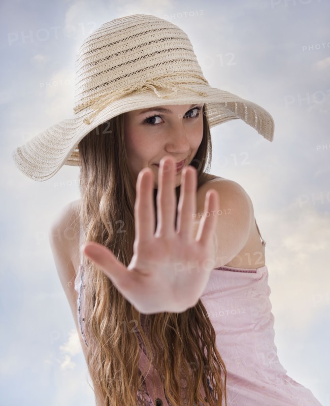 Woman holding her hand out in front of her. Photo : Mike Kemp