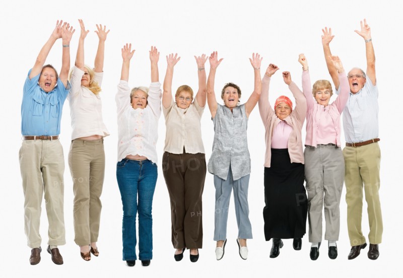 A group of people jumping with their arms raised. Photo : momentimages