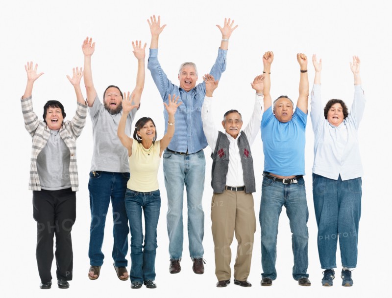 A group of people jumping with their arms raised. Photo : momentimages