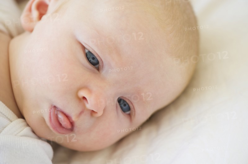 Infant sticking his tongue out. Photo : Chris Grill
