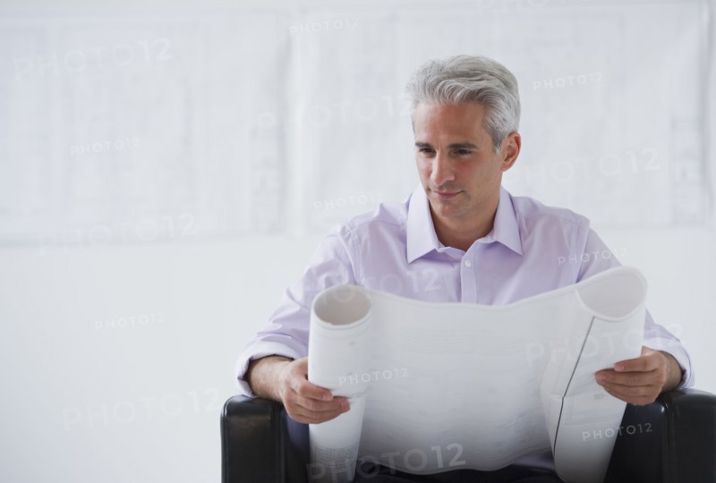 Architect looking at house plans.