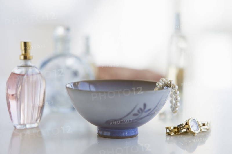 Woman's items on dresser.