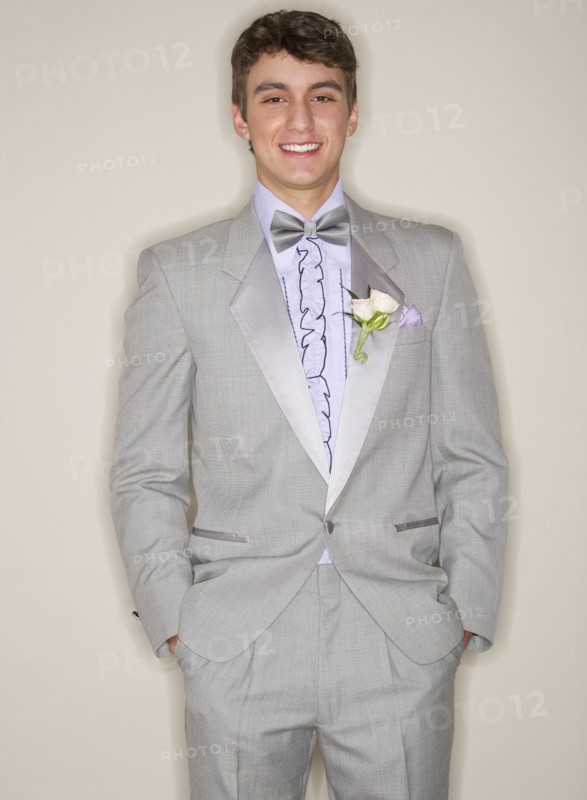Man wearing grey tuxedo.