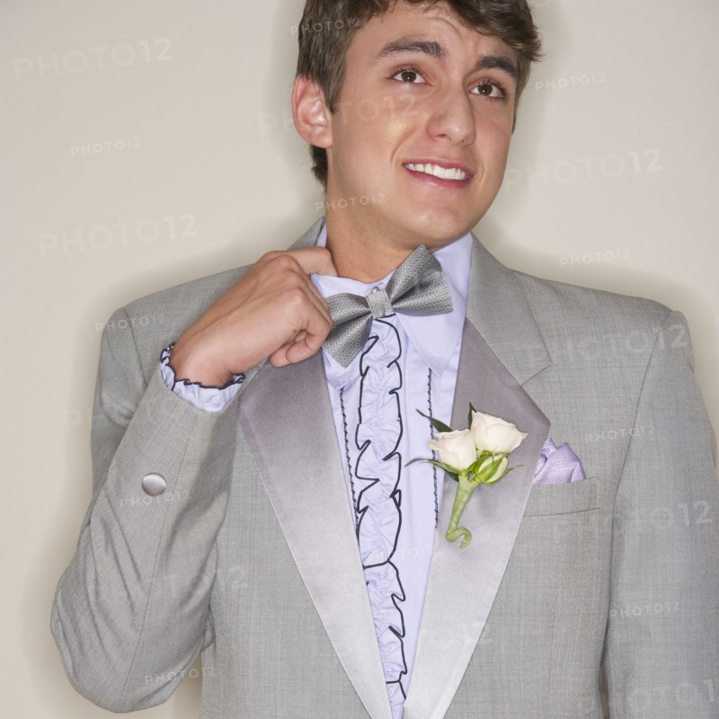 Man wearing grey tuxedo.