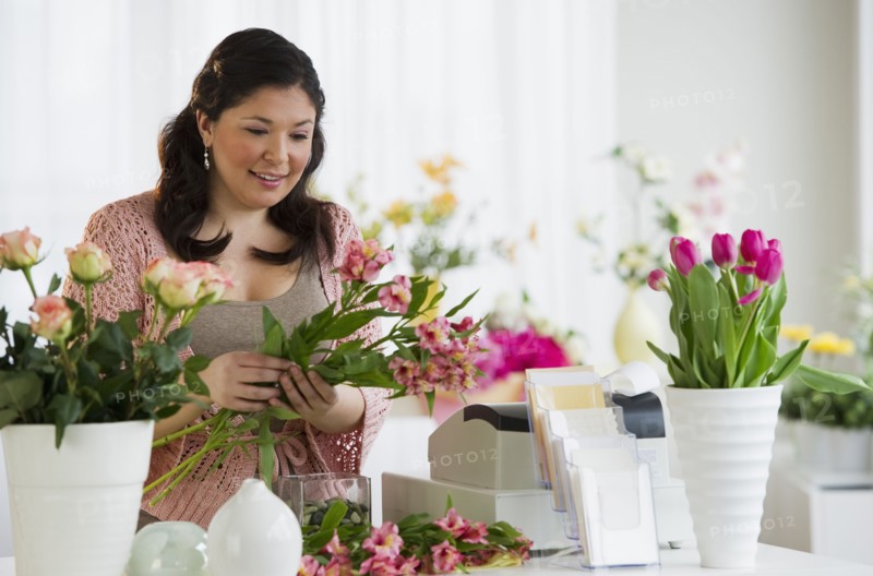 Florist making a floral arrangement.