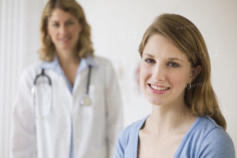 Doctor and patient in exam room.