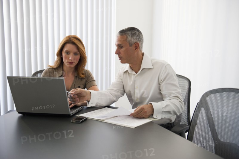 Business people in conference room.