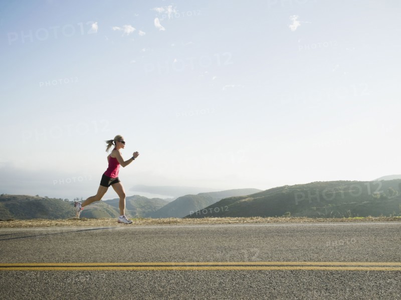 Runner training on the side of the road.