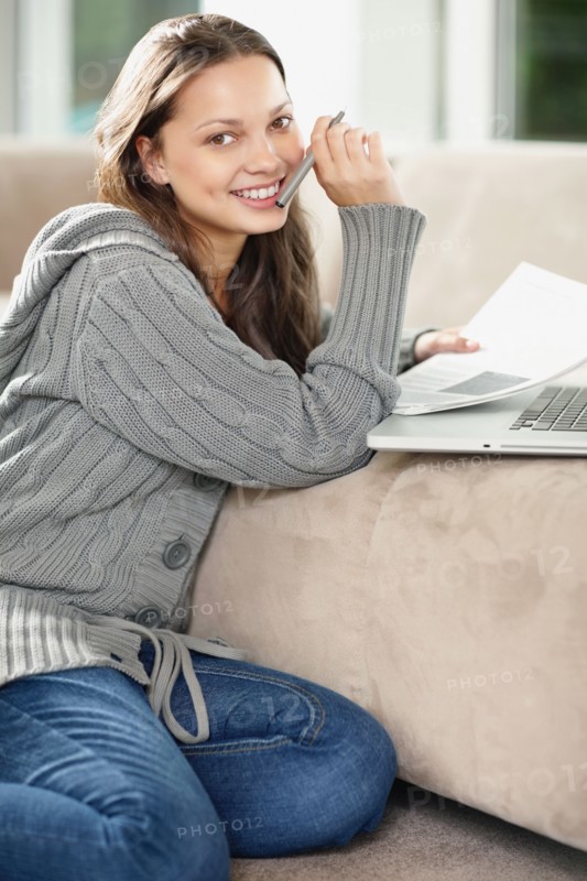 Woman doing paperwork. Photo. momentimages