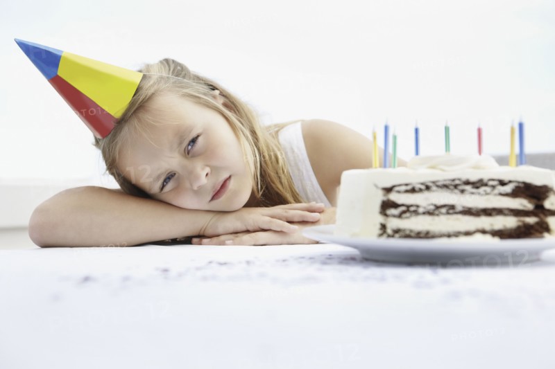Tired birthday girl. Photo. momentimages