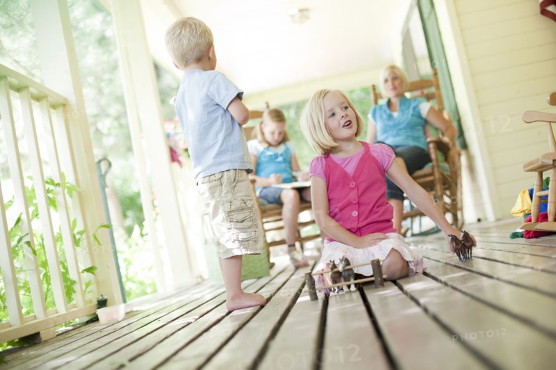 Children playing on porch. Photo. Tim Pannell