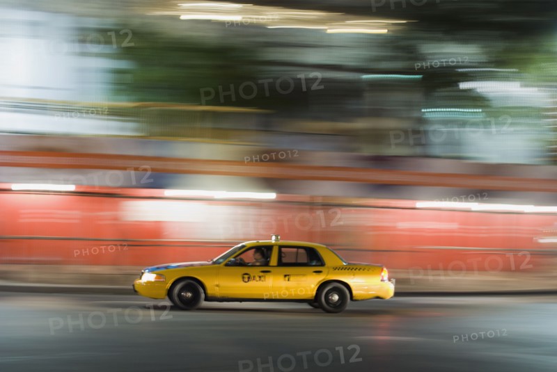 Taxi cab driving at night. Photo : Antonio M. Rosario