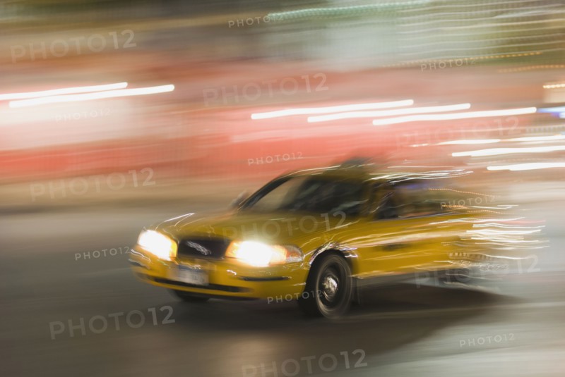 Taxi cab driving at night. Photo. Antonio M. Rosario