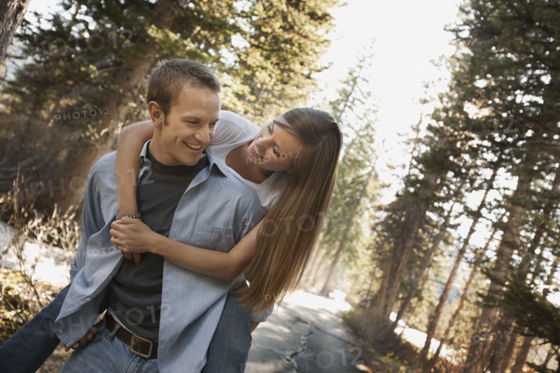 Man giving girlfriend a piggyback ride. Photo. FBP