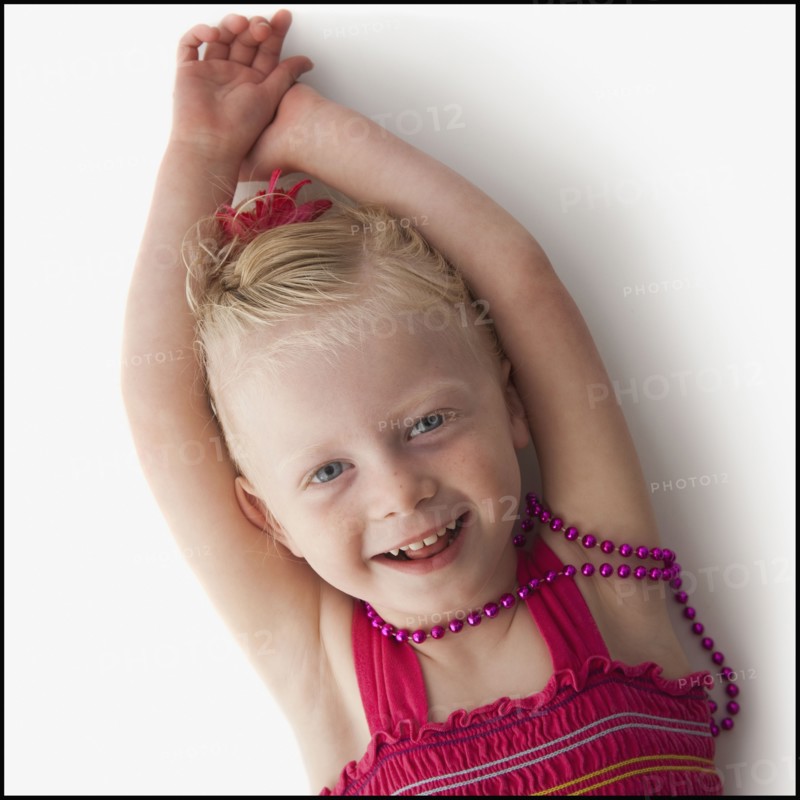 Cute young girl lying down. Photo. Mike Kemp