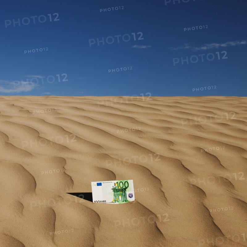 100 euro bill on sand in desert. Photo. Mike Kemp