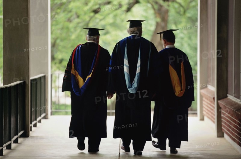 Three adult graduates. Photo. Stewart Cohen