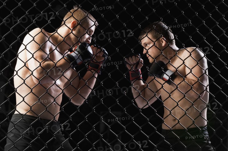 Cage fighters. Photo. Mike Kemp