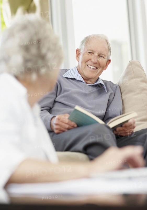 Senior man reading a book. Photo. momentimages