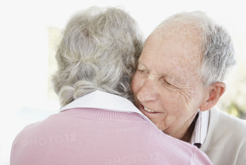 Senior couple hugging. Photo. momentimages