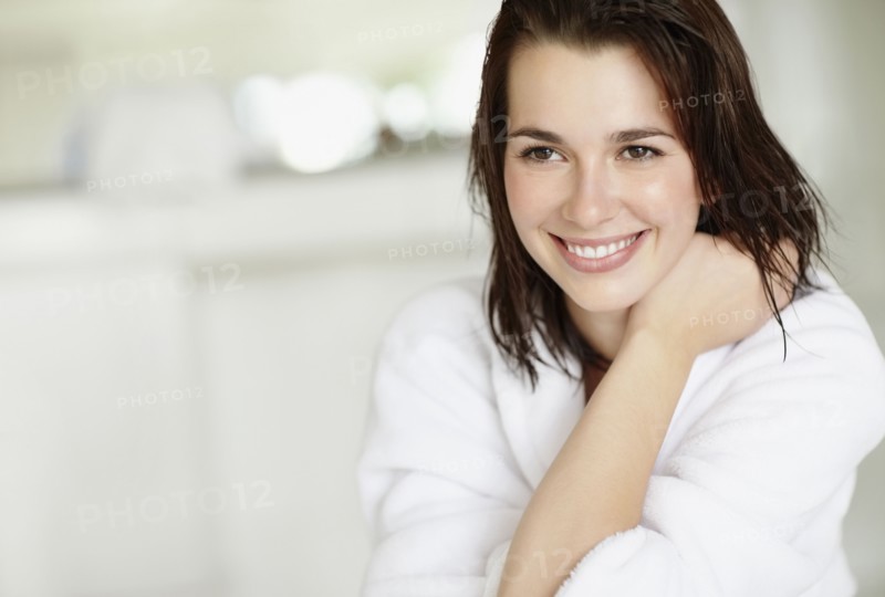 Woman wearing bathrobe. Photo. momentimages