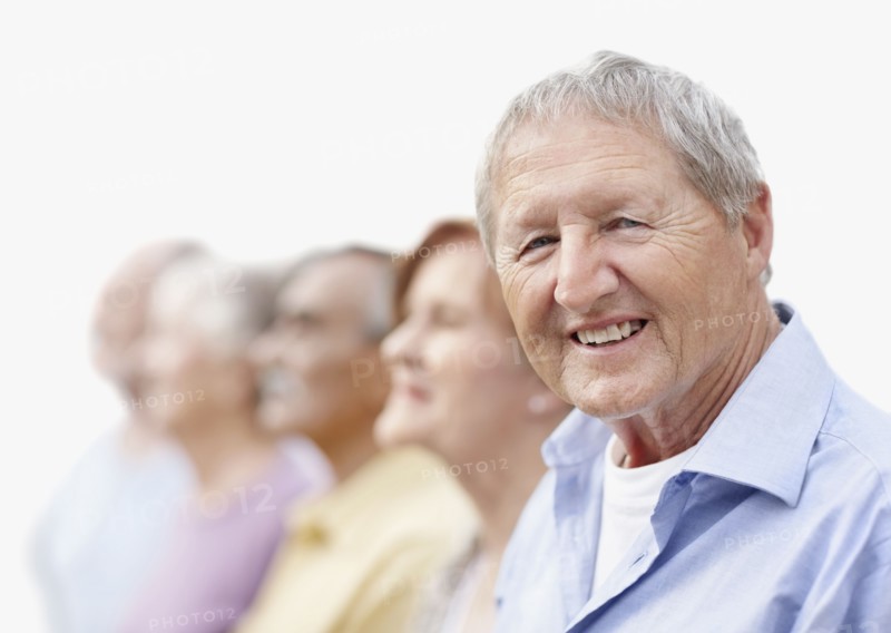Group of seniors standing in a row. Photo. momentimages