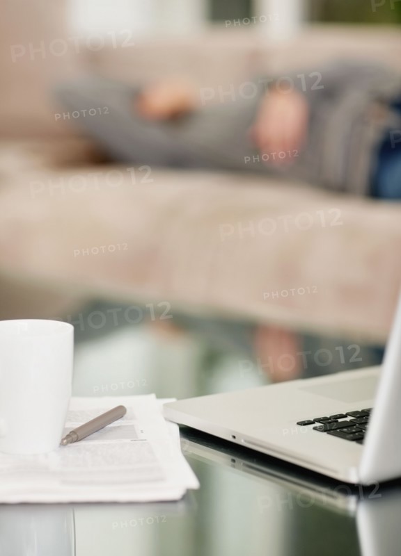 Paperwork and laptop on desk. Photo. momentimages
