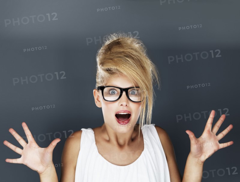 Shocked glamorous blond woman. Photo. momentimages