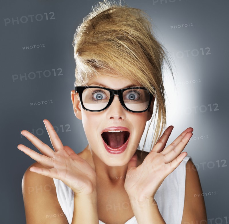 Shocked glamorous blond woman. Photo. momentimages