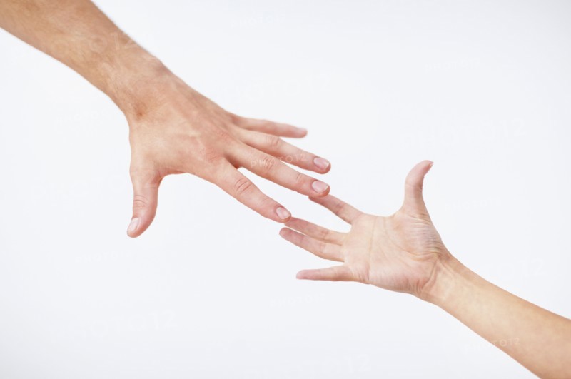 Hands reaching. Photo. momentimages
