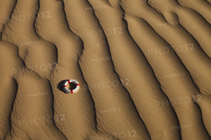 Lifebuoy in desert. Photo. Mike Kemp