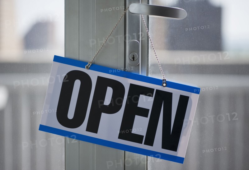 Open sign hanging on door. Photo. Daniel Grill