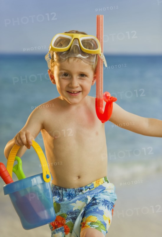 Young boy playing at the beach. Photo. Daniel Grill