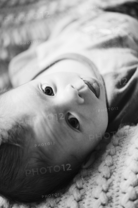 Baby lying down. Photo. Jamie Grill