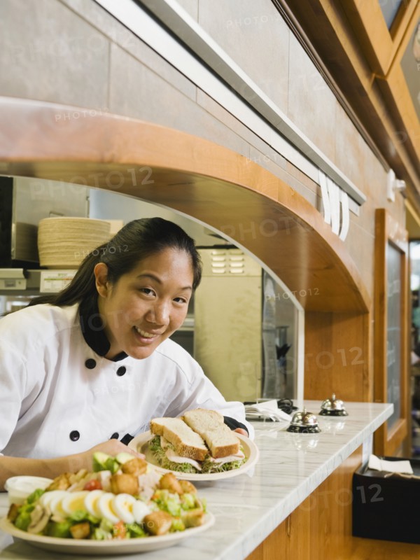 Chef leaning on counter. Photo. Erik Isakson