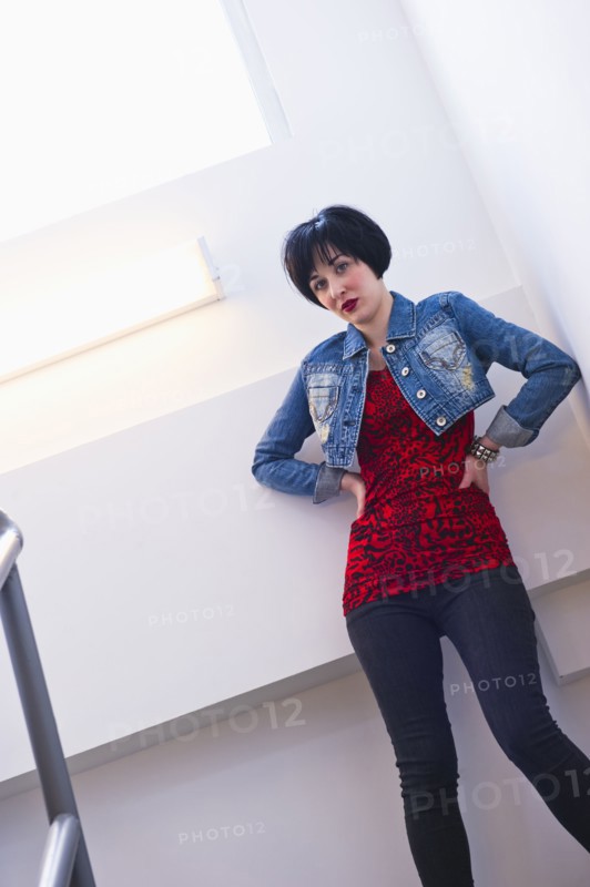 Woman standing in stairwell. Photo : Daniel Grill