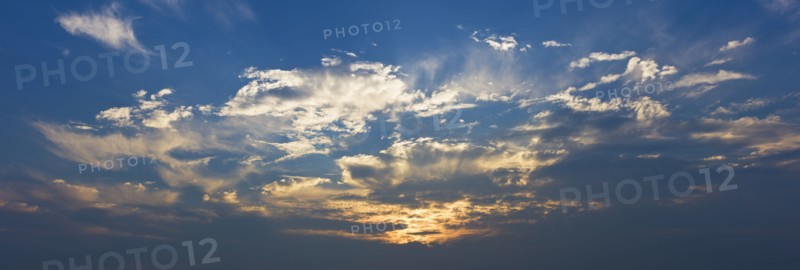 Sunset behind clouds.
