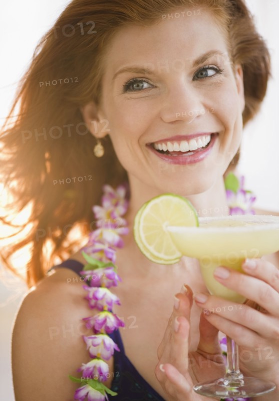 Woman drinking a frozen cocktail. Photo : Jamie Grill
