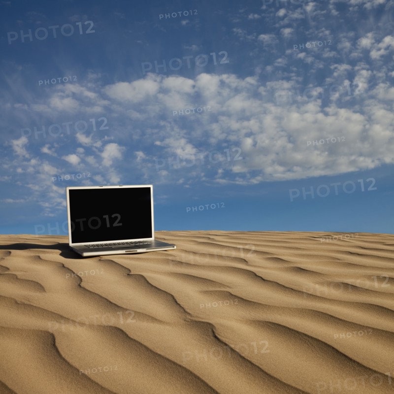 Laptop computer on desert sand. Photo. Mike Kemp