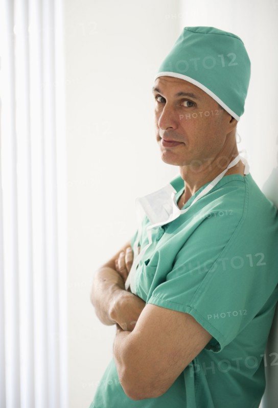 Surgeon wearing medical scrubs.