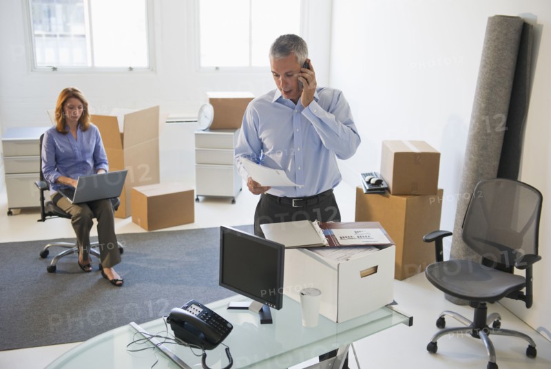 Business entrepreneurs working in startup office.