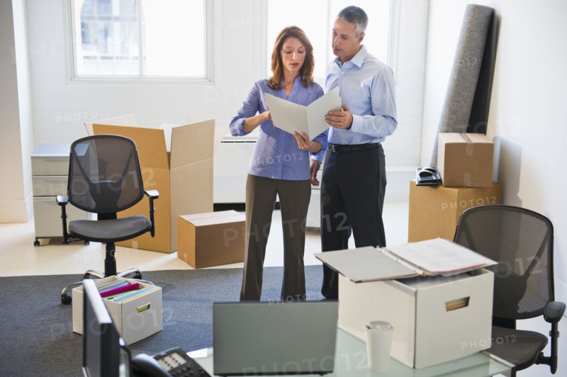 Business entrepreneurs working in startup office.