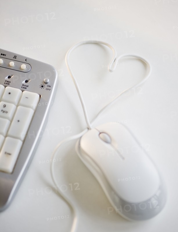 Computer mouse wire in shape of heart. Photo. Jamie Grill