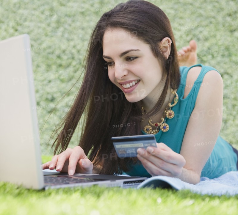 Young woman shopping online. Photo. Jamie Grill