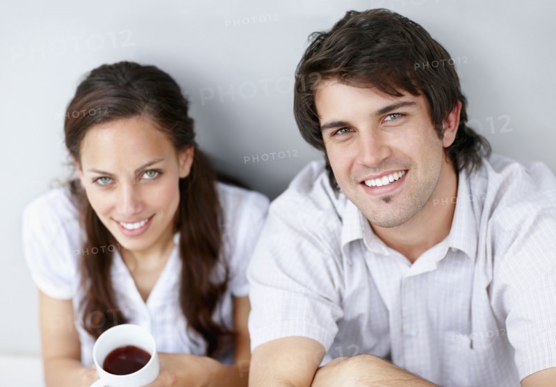 Two people relaxing together. Photo. momentimages