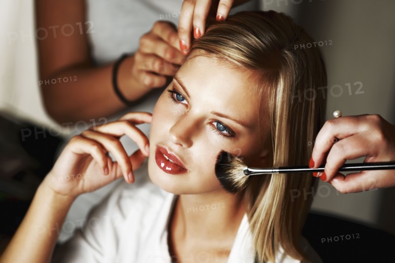 Fashion model being styled. Photo. momentimages