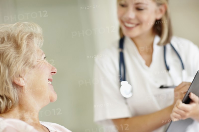 Nurse and senior patient. Photo. momentimages